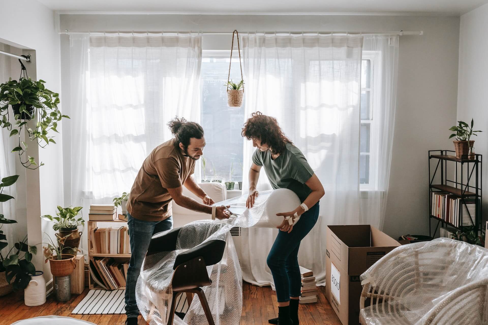 Couple packs furniture for removal